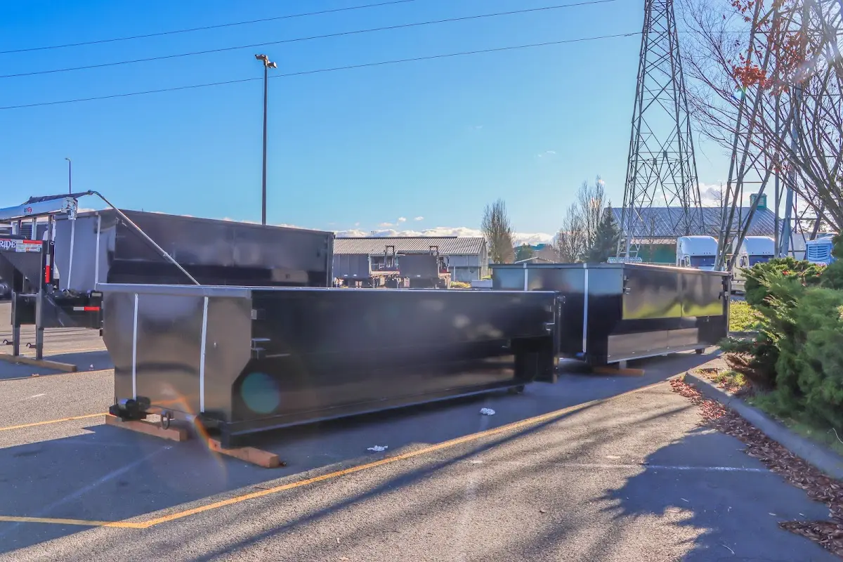 Roll-off dumpster ready for waste disposal at job site for 4 Yard Dumpster Rental in West Point